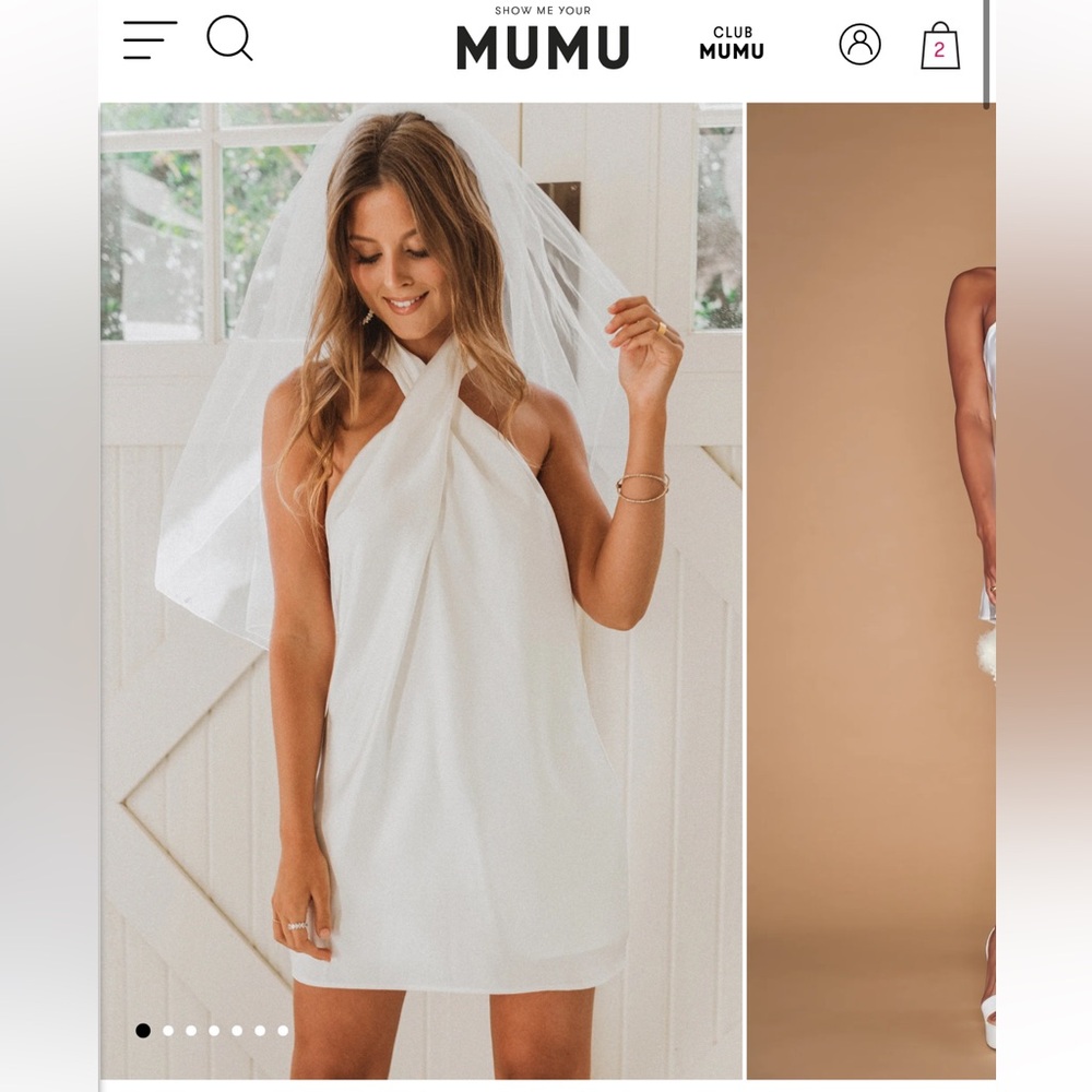 Show me your mumu dress. Never worn. Size small. Sticky tape placed but removed